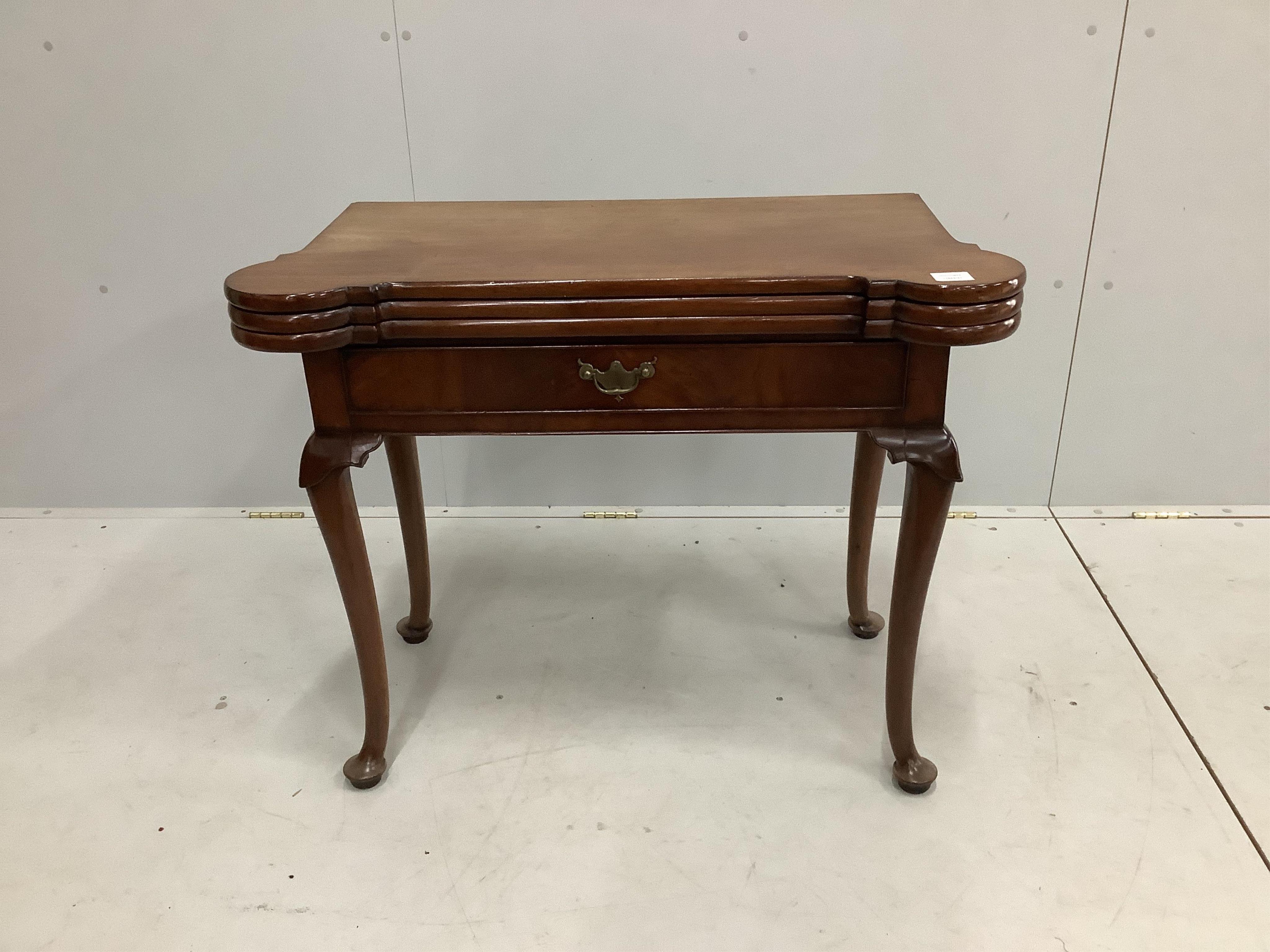 An 18th century mahogany double folding tea / card table, width 90cm, depth 45cm, height 74cm. Condition - fair